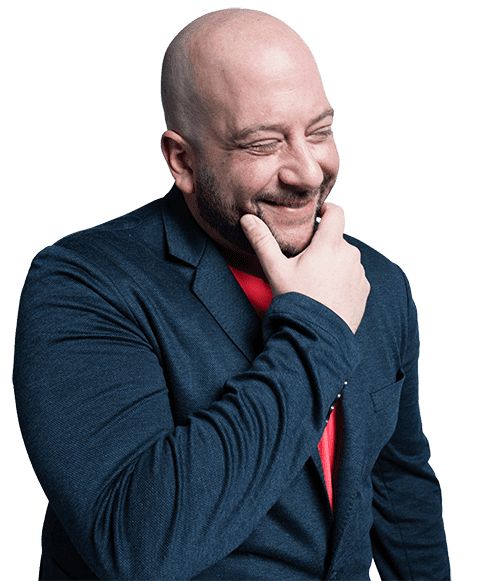 A man in a suit with a finely trimmed beard.